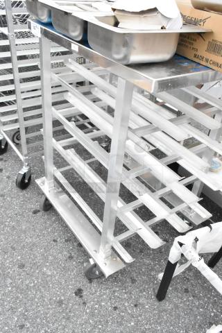Metal commercial #10 can rack on casters, featuring sturdy metal construction and multiple storage slots.
