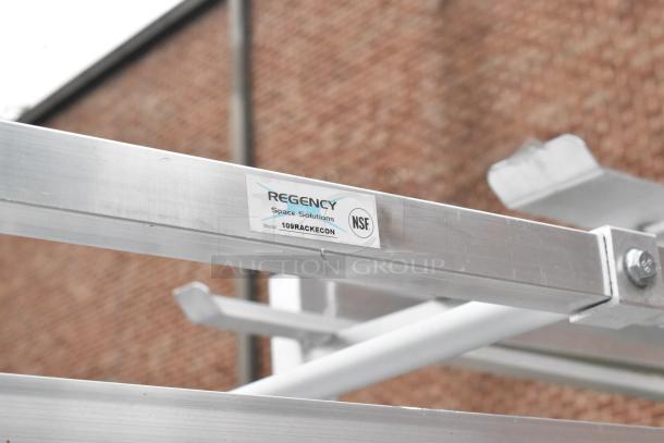 Regency 109RACKECON metal pan transport rack, NSF-certified, on commercial casters, label visible. Ideal for commercial use.