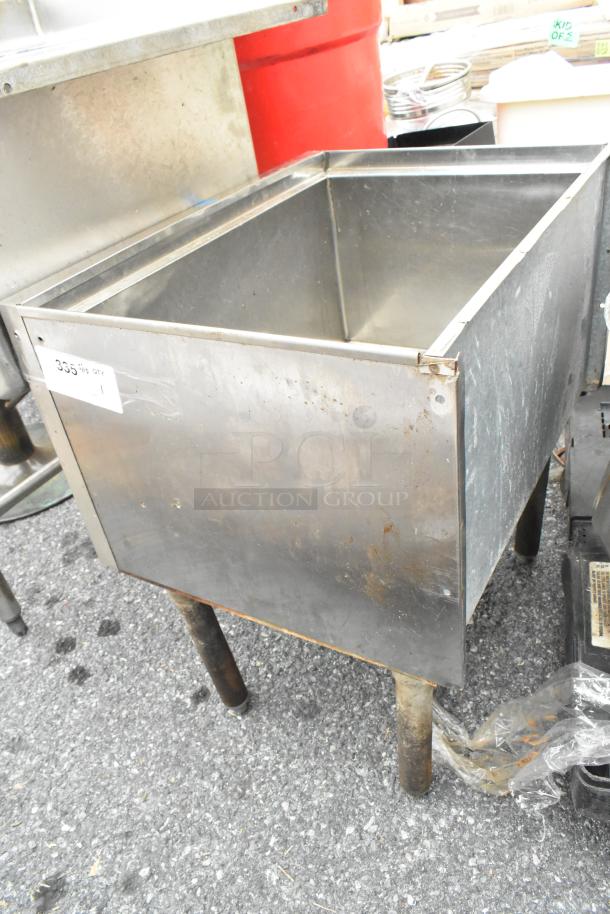 Stainless Steel Ice Bin with visible wear. Features sturdy legs and a label with the number 355 indicating quantity.