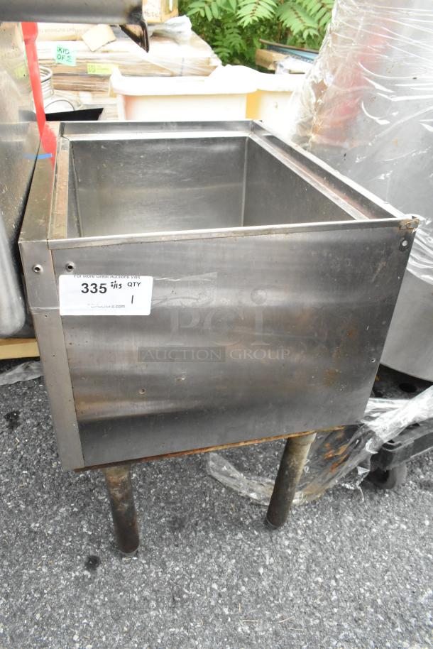 Stainless steel ice bin with moderate wear, featuring sturdy legs. Label indicates quantity as 1, lot number 335.