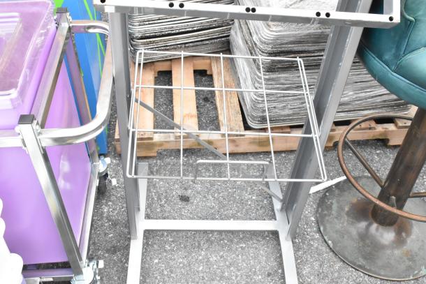 Metal signs with grid frames, used condition, suitable for display or retail use; image shows structural details.