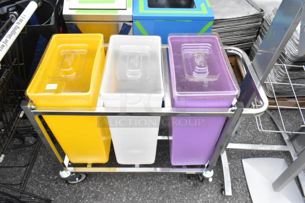 Three poly ingredient bins in yellow, white, and purple within a stainless steel frame on wheels, in good condition.
