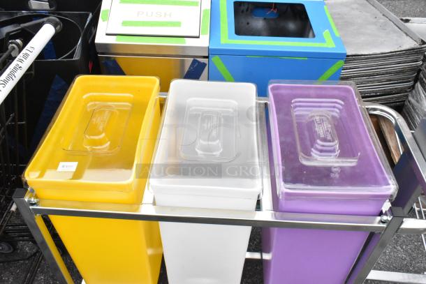Yellow, white, and purple poly ingredient bins in a metal frame, each with labeled lids and a storage dolly on wheels.