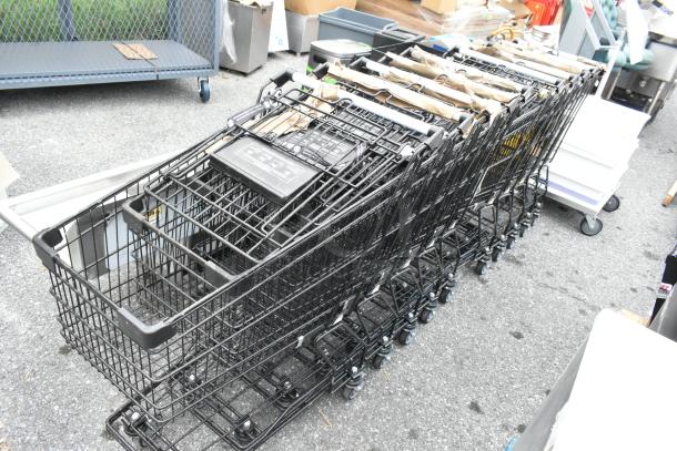 10 metal shopping carts on casters, stacked. Used condition. Features handles, black wire baskets, standard size.