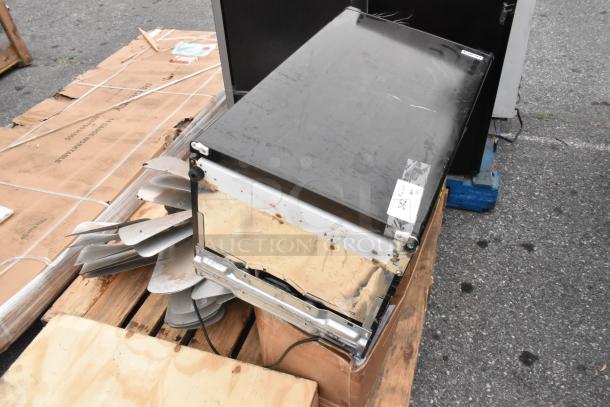 12 various items, including metal fan blades, on a wooden pallet. Items in used condition. Auction tag visible.