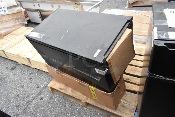 A collection of 12 assorted items on pallets, including boxes and metal fan blades. Items appear in used condition.