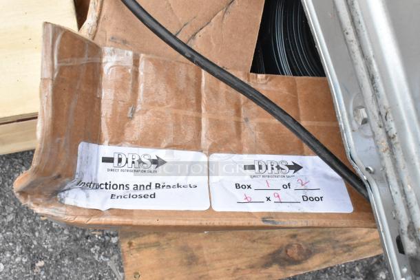 Cardboard box with DRS branding, labels indicate instructions and brackets enclosed. Box 1 of 2. Includes metal fan blades.