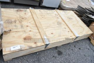 Brand new Hussmann 0522314 door, sealed in wooden crate, visible label indicating item number and quantity.