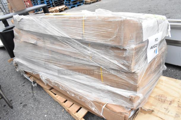 Pallet of five new scratch and dent commercial work tables wrapped in plastic, including Regency and Steelton stainless models.