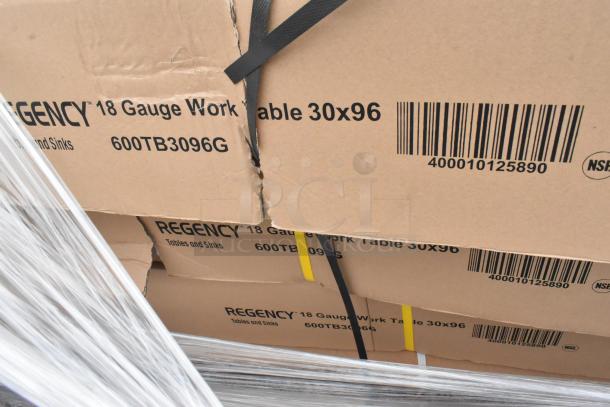 New Regency stainless steel work tables in boxes, model 600TB3096G, 18-gauge, 30x96, with packaging straps.