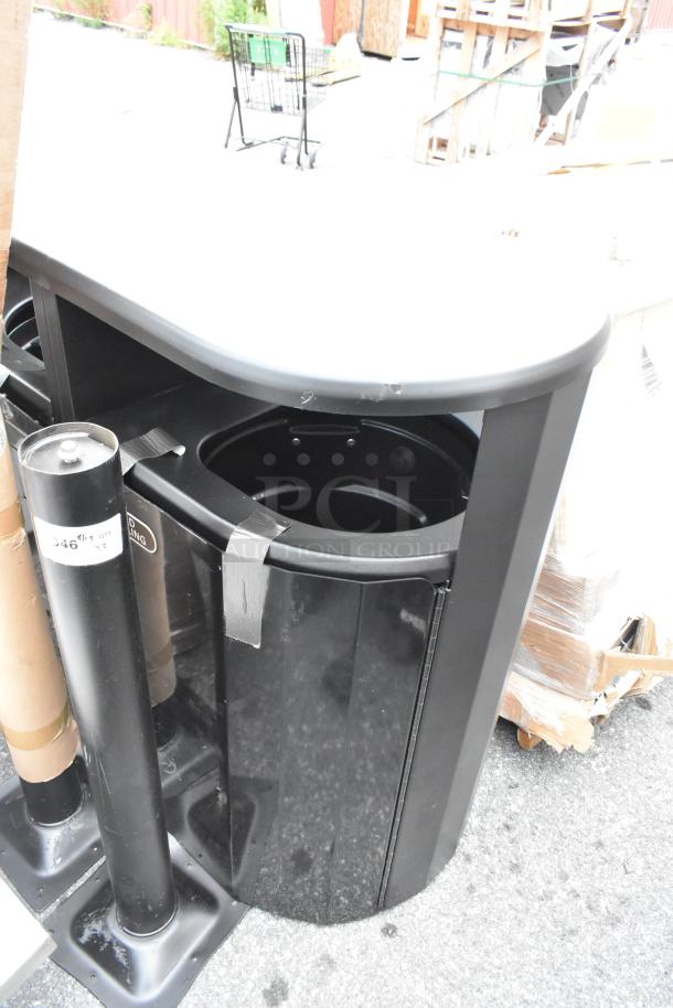 Brand new black metal double trash can shell, scratched and dented, featuring dual compartments and sturdy construction.