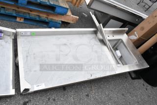Brand new Regency 600ST3072R stainless steel table with single bay sink, scratch and dent condition, visible labels.