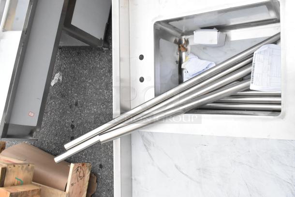 BRAND NEW Regency 600ST3072R stainless steel table with single bay sink, visible scratch, includes documentation and materials.