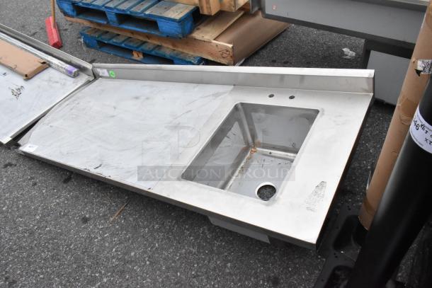 BRAND NEW SCRATCH AND DENT Regency 600ST3072R Stainless Steel Table with single bay sink, moderate surface scratches visible.