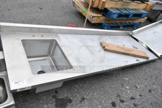 BRAND NEW SCRATCH AND DENT Regency 600ST3096L stainless steel table with single bay sink, visible scratches.