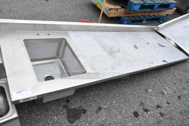 Brand new Regency 600ST3096L stainless steel table with single bay sink, slight scratch and dent condition, NSF certified.