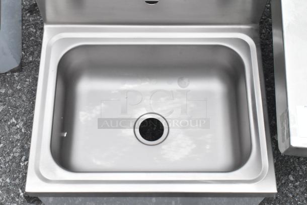 New Regency 600HS17KSPT 17"x15" wall-mounted hand sink, stainless steel, knee-operated valve, minor scratches.