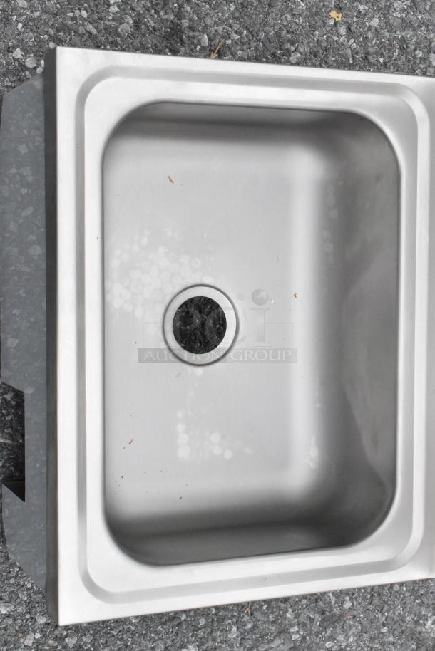 "New Regency 600HS17KSPT 17x15" wall-mounted hand sink with knee-operated valve. Scratch and dent condition."