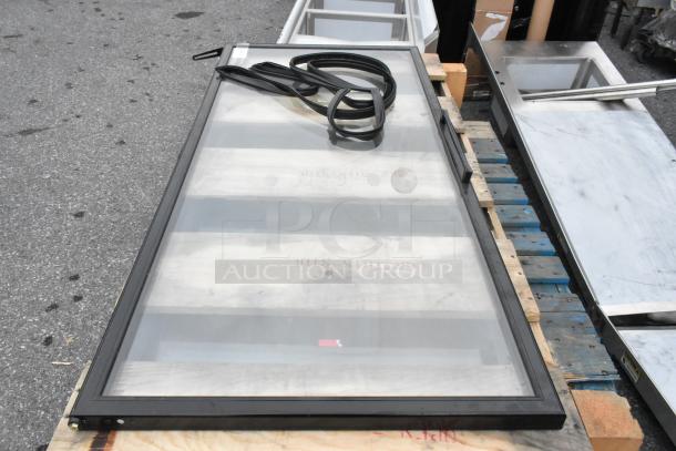 Slimline Black 3 Pane Reflective Door, brand new, with minimal scratches. Includes seal.