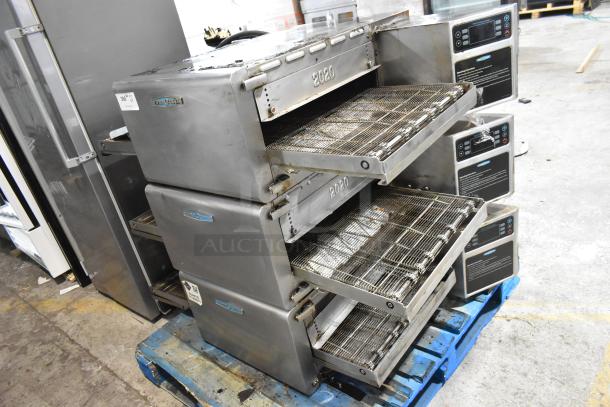 Three 2017 Turbochef HhC2020 stainless steel commercial electric rapid cook conveyor ovens on a pallet, in good condition.