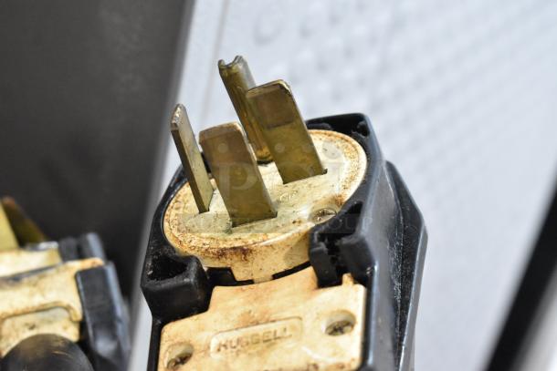 Close-up of a Hubbell plug on a 2017 Turbochef HhC2020 stainless steel rapid cook conveyor oven, 208/240 volts, 3 phase.