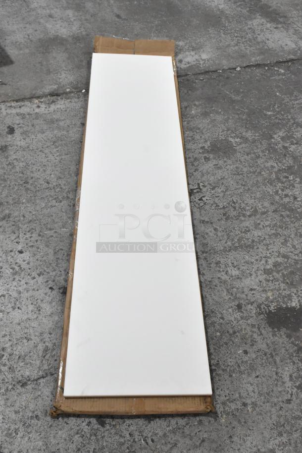 Brand new scratch and dent cutting board, white, long rectangular shape. Minimal blemishes, packaged on cardboard.