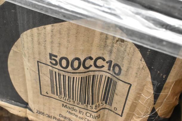 Cardboard box marked '500CC10' with barcode, displaying minor wear. Contains 20 new scratch and dent items: containers, lids, sporks.