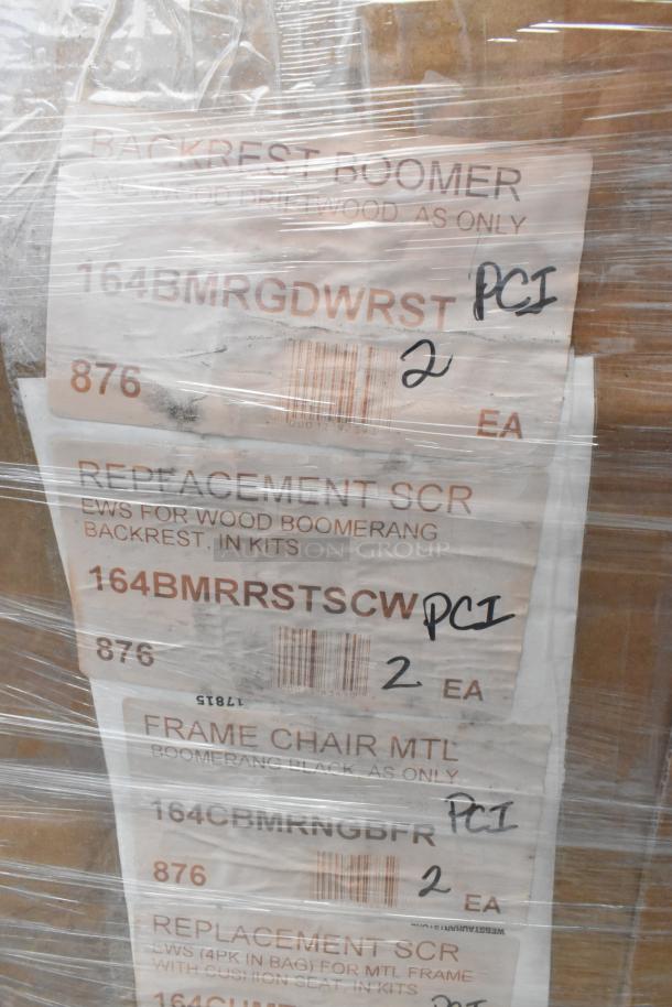 Pallet with chair frames and pieces, labeled for "Boomerang" chair parts. Barcodes and PCI handwritten on labels. New, scratch and dent condition.