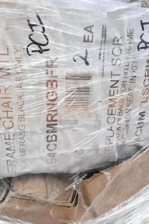 Brand new scratch and dent chair frames and pieces, wrapped in plastic. Labels indicate "Boomerang Black" and "2 EA".