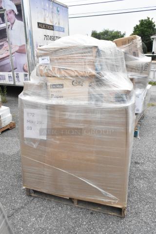 Pallet of 23 new scratch and dent items including spoons, cups, and paper cones. Boxes wrapped in plastic with labels visible.