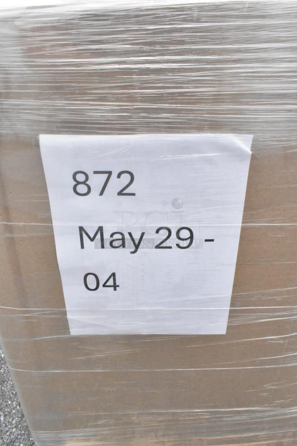 Pallet with label "872 May 29 - 04," containing 26 new scratch and dent items like register paper rolls, hot cups, ice bags.