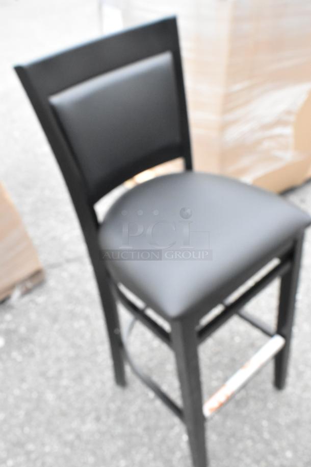 Lancaster Table & Seating Sofia black wood bar stool with black vinyl seat, assembled, new with scratches and dents.