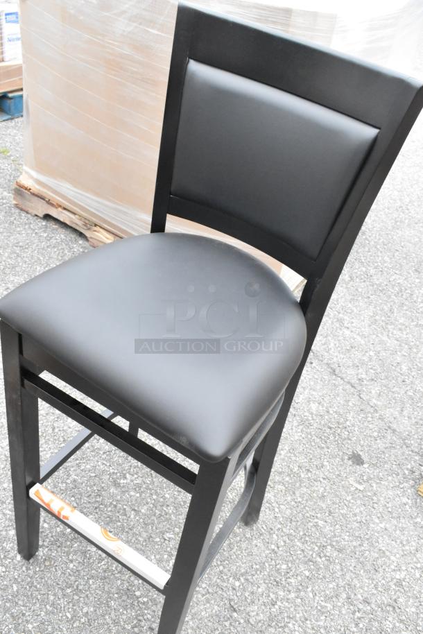Lancaster Table & Seating Sofia bar stool, black wood finish, black vinyl seat, scratch and dent condition, assembled.