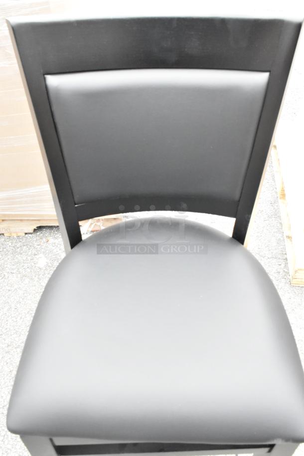 Lancaster Table & Seating Sofia bar stool with black finish wood and black vinyl seat, new scratch and dent condition.