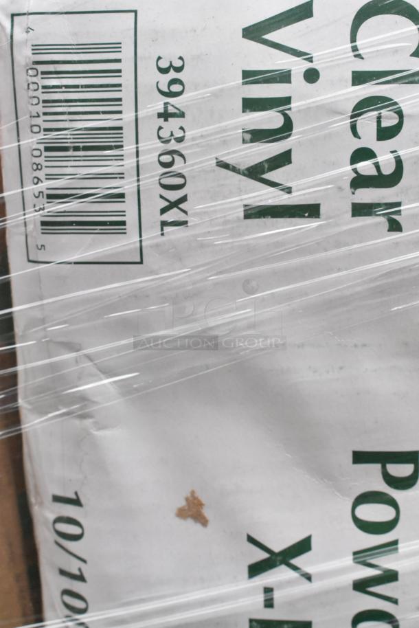 Packaged scratch and dent items including containers, lids, and plates wrapped in plastic, visible barcode and label text.