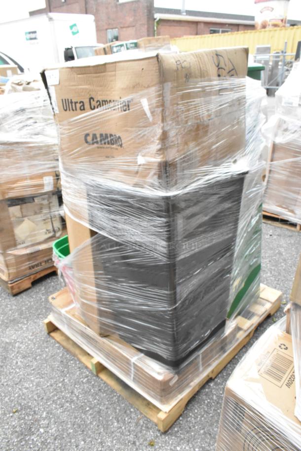 Auction pallet with 26 scratch and dent items, including trash cans, martini glasses, and cocktail shakers. Cambro box visible.