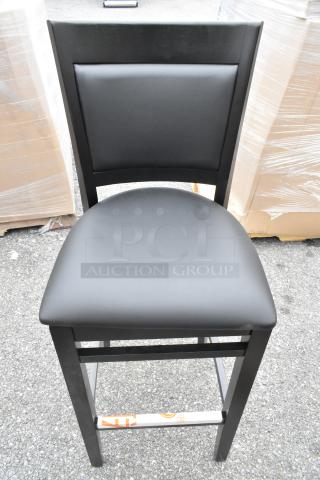 9 Lancaster Sofia bar stools, black wood finish, black vinyl seats, assembled, new scratch and dent condition.
