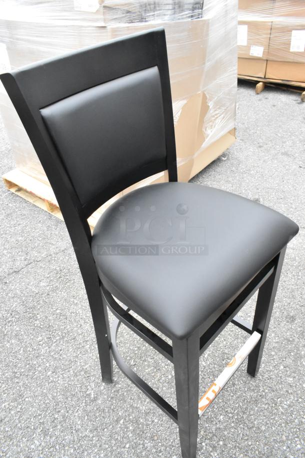 Lancaster Table & Seating Sofia black wood bar stool with black vinyl seat, new, slight scratch and dent, assembled.