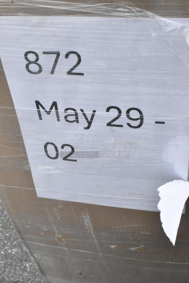 Box labeled "872 May 29 - 02" containing 30 new scratch and dent items: paper towels, plates, portion cups, and cups.