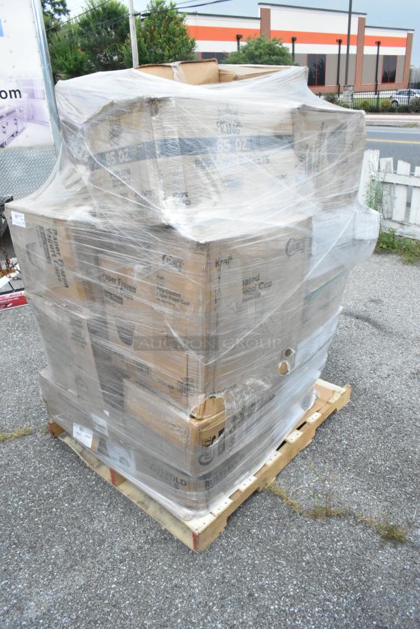 Pallet of 24 new scratch and dent items, including Kraft food cups and Carnival King products, wrapped in plastic.