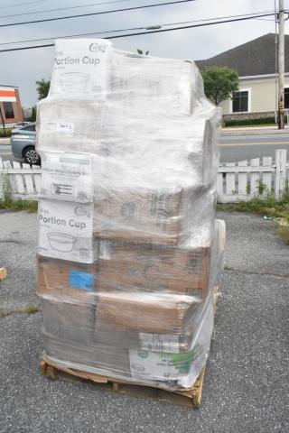 Pallet of 32 assorted scratch and dent items, including portion cups, cutlery, and trash bags, wrapped in plastic.