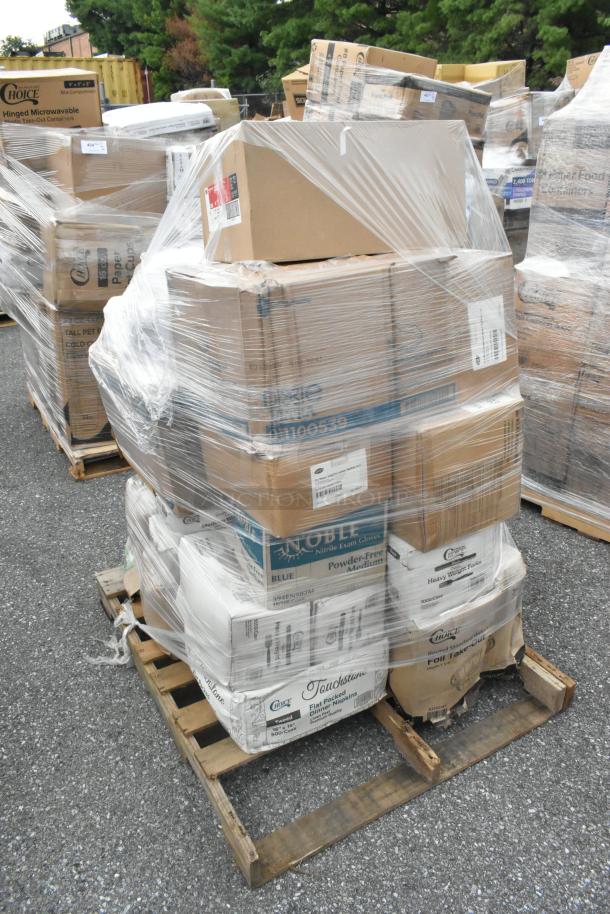 Stack of sealed boxes containing scratch and dent items, lids, takeout pans, and napkins on a pallet. Multiple brand labels visible.