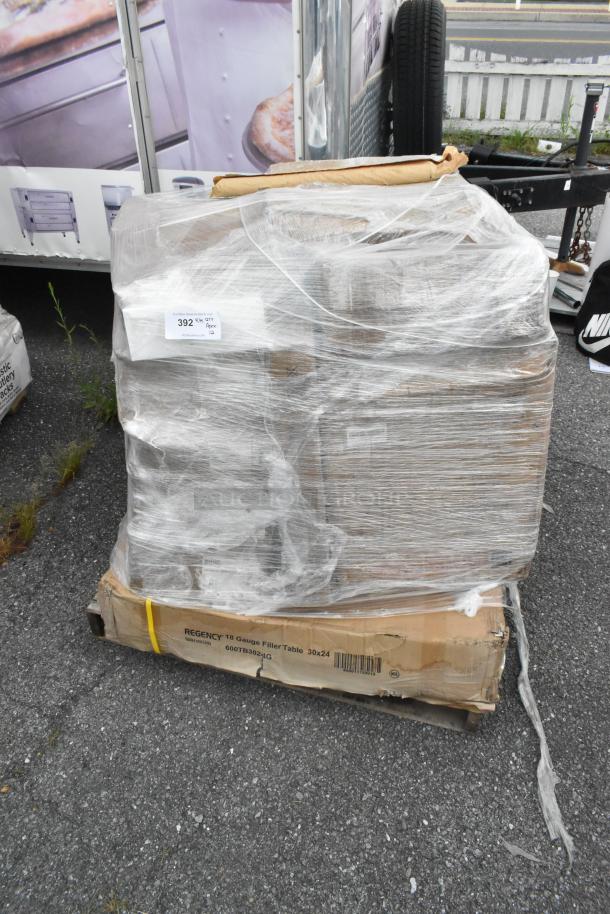 Shrink-wrapped pallet of 12 new scratch and dent items including glasses, shelves, dustpan. Regency label on box.