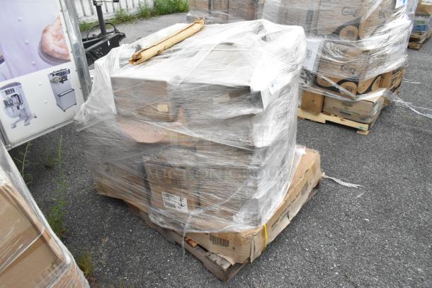 Pallet wrapped in plastic contains scratch and dent items like glasses, shelves, and a dustpan. Items are new.