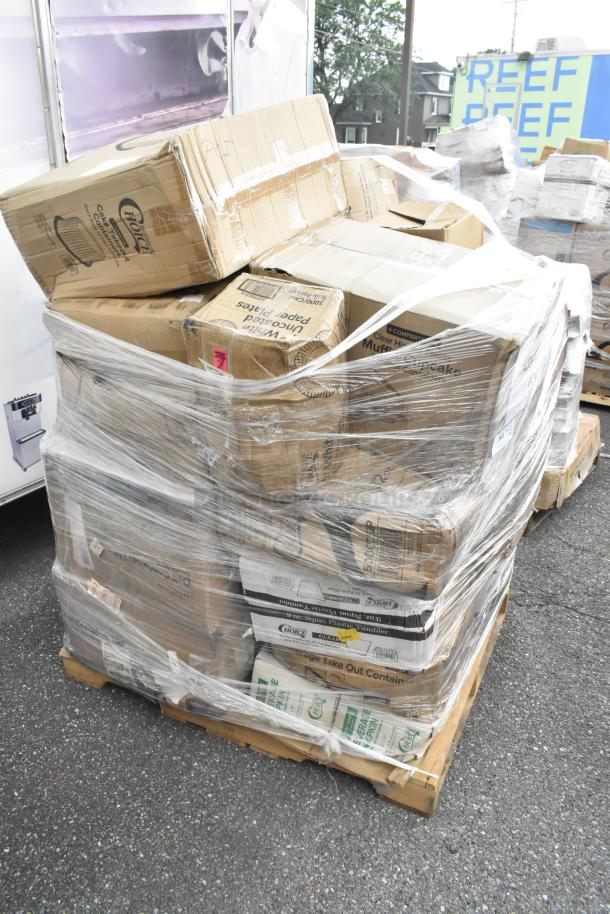 Shrink-wrapped pallet of various brand new scratch and dent items including disposable to-go containers, napkins, and trash bags.