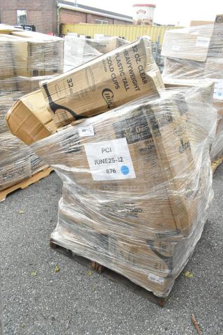 Shrink-wrapped pallet with scratch and dent boxes labeled "32 oz. clear plastic cups," "PCI," and "JUNE25-32 876."