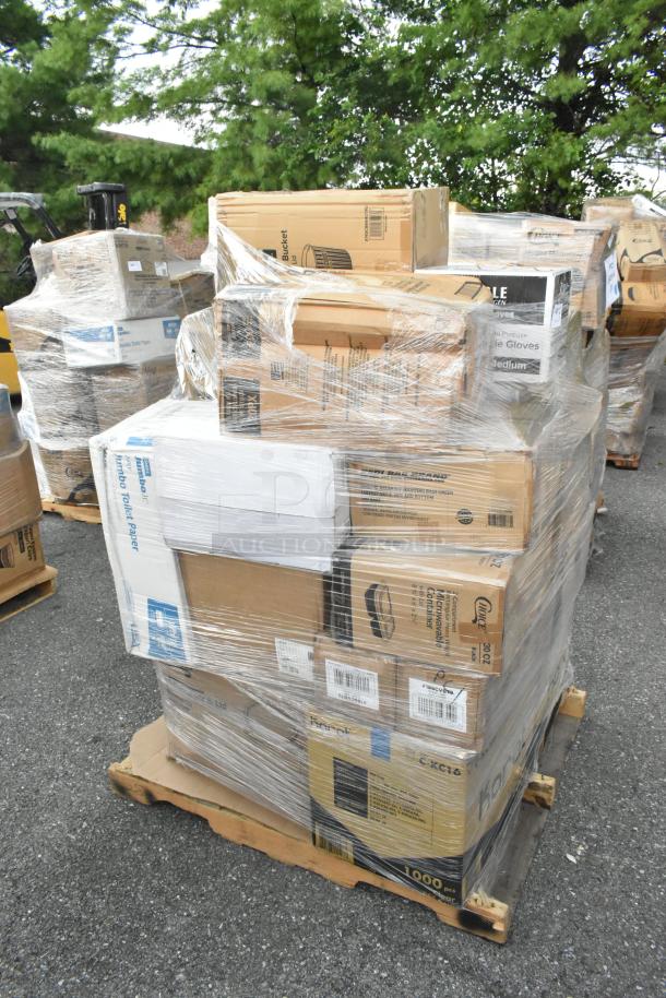 Shrink-wrapped pallet with 26 scratch and dent items including to-go containers, toilet paper, and gloves. Various brands visible.