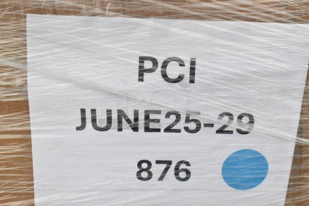 Packaging showing "PCI JUNE25-29 876" label, part of a lot containing 26 new scratch and dent items like yogurt lids and containers.