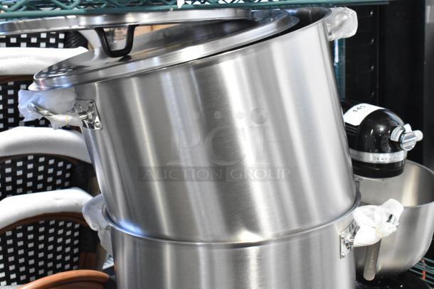 Set of 3 stainless steel stock pots and 1 colander/steam pot, excellent condition, with sturdy handles and lids.