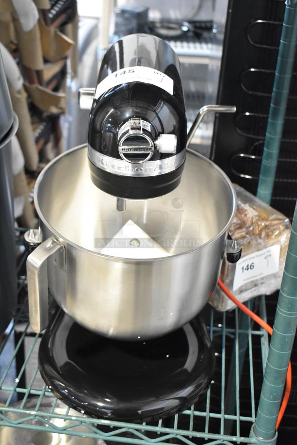 KitchenAid KSM8990OB metal countertop planetary dough mixer with metal mixing bowl, 120V, shown on display.